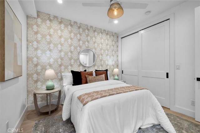 2004 Grant Ave Unit B, Redondo Beach, CA 90278 - bedroom featuring wallpapered walls, a closet, wood finished floors, and a ceiling fan
