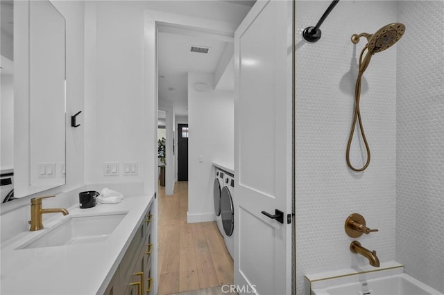 2004 Grant Ave Unit B, Redondo Beach, CA 90278 - bathroom featuring vanity, hardwood / wood-style flooring, shower / bath combination, and washer / dryer