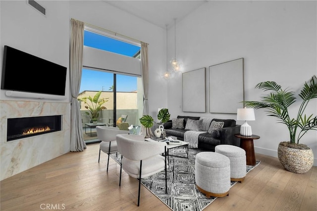 2004 Grant Ave Unit B, Redondo Beach, CA 90278 - living area featuring high vaulted ceiling, a fireplace, and hardwood / wood-style floors
