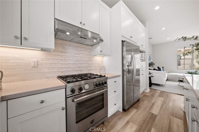 206 Milky Way, Irvine, CA 92618 - kitchen with stainless steel appliances, under cabinet range hood, light countertops, and recessed lighting