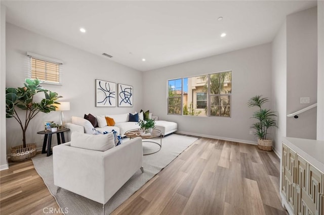 206 Milky Way, Irvine, CA 92618 - living area with light wood-type flooring, recessed lighting, and baseboards