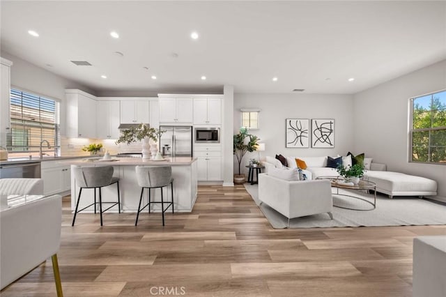 206 Milky Way, Irvine, CA 92618 - living area featuring recessed lighting and light wood finished floors