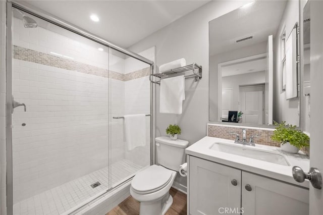 206 Milky Way, Irvine, CA 92618 - bathroom with wood finished floors, vanity, toilet, a stall shower, and decorative backsplash