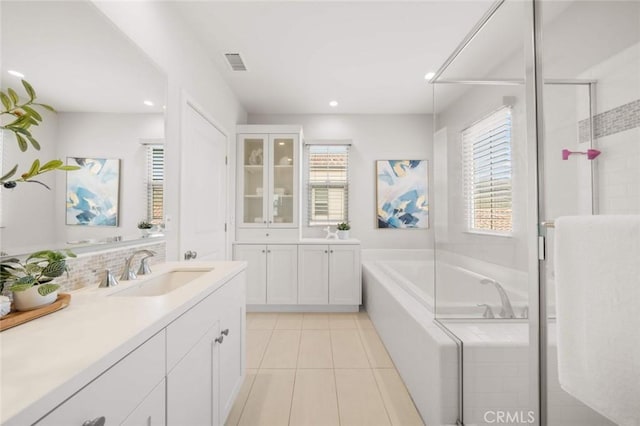 206 Milky Way, Irvine, CA 92618 - bathroom with vanity, a garden tub, tile patterned flooring, a stall shower, and decorative backsplash