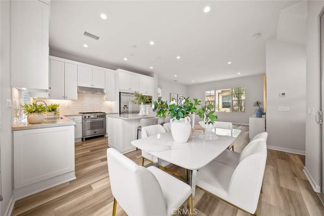 206 Milky Way, Irvine, CA 92618 - dining area featuring recessed lighting, light wood finished floors, and baseboards