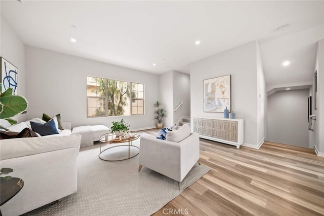 206 Milky Way, Irvine, CA 92618 - living area featuring recessed lighting, light wood-style floors, baseboards, and stairway