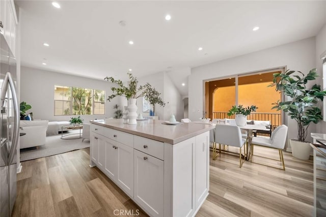 206 Milky Way, Irvine, CA 92618 - kitchen featuring recessed lighting, white cabinets, freestanding refrigerator, light countertops, and light wood-style floors