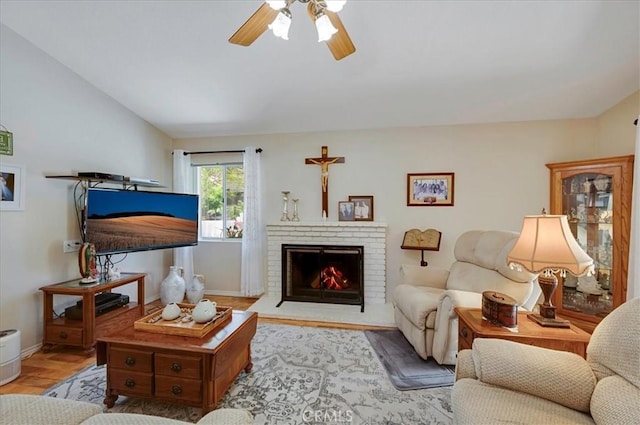 21332 Silver Spur Ln, Wildomar, CA 92595 - living area featuring a ceiling fan, wood finished floors, and a brick fireplace