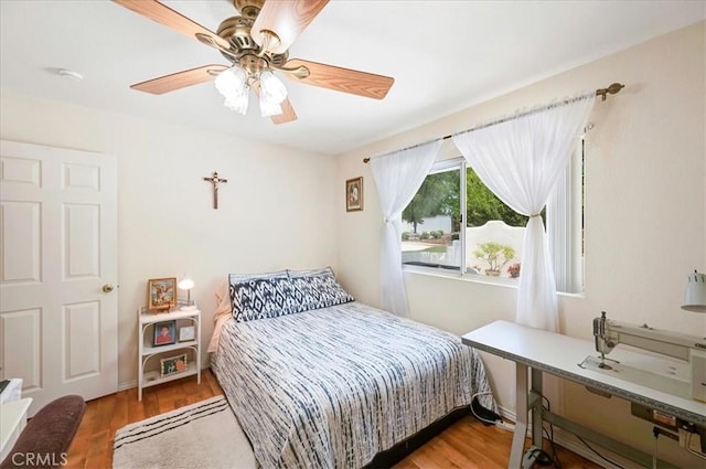 21332 Silver Spur Ln, Wildomar, CA 92595 - bedroom featuring a desk, a ceiling fan, and wood finished floors