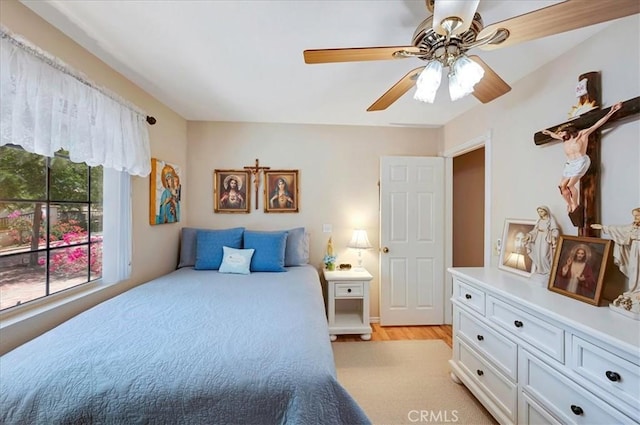 21332 Silver Spur Ln, Wildomar, CA 92595 - bedroom with light wood-type flooring and a ceiling fan
