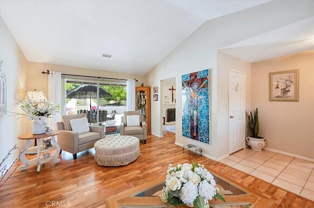 21332 Silver Spur Ln, Wildomar, CA 92595 - living room featuring lofted ceiling and wood finished floors
