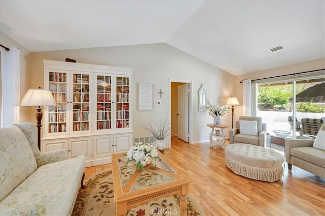 21332 Silver Spur Ln, Wildomar, CA 92595 - living room with vaulted ceiling and light wood-type flooring