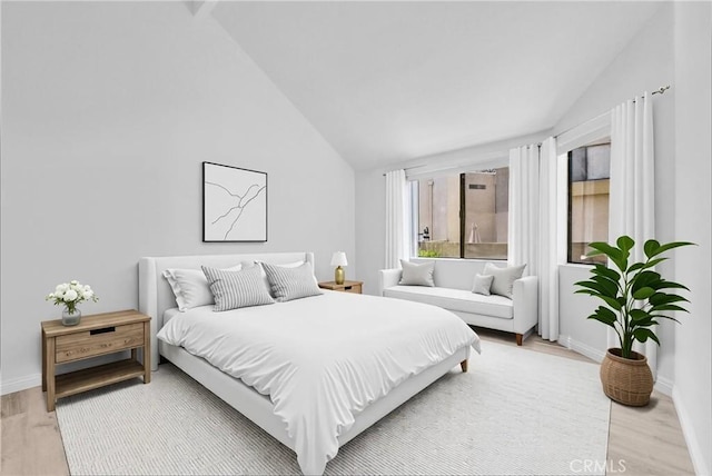 13104 Glen Ct Unit 28, Chino Hills, CA 91709 - bedroom with light wood-style floors and high vaulted ceiling