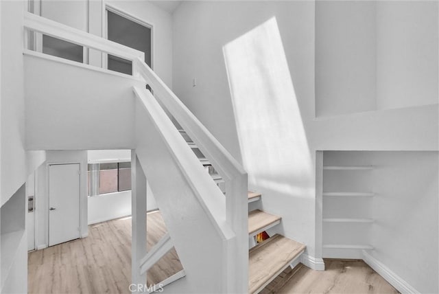 13104 Glen Ct Unit 28, Chino Hills, CA 91709 - staircase featuring wood finished floors and baseboards