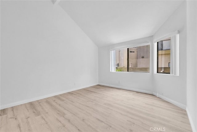 13104 Glen Ct Unit 28, Chino Hills, CA 91709 - unfurnished room featuring vaulted ceiling and wood finished floors