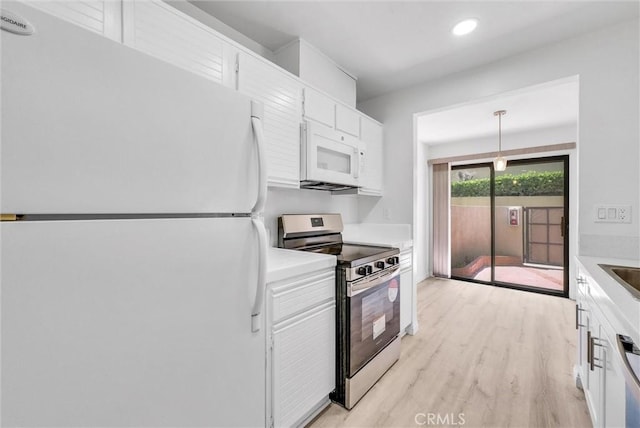 13104 Glen Ct Unit 28, Chino Hills, CA 91709 - kitchen with appliances with stainless steel finishes, light countertops, white cabinetry, light wood-type flooring, and recessed lighting