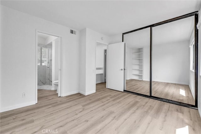 13104 Glen Ct Unit 28, Chino Hills, CA 91709 - unfurnished bedroom featuring wood finished floors, a closet, and connected bathroom