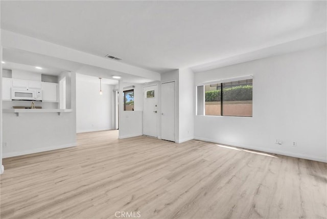 13104 Glen Ct Unit 28, Chino Hills, CA 91709 - unfurnished living room with light wood finished floors