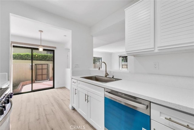 13104 Glen Ct Unit 28, Chino Hills, CA 91709 - kitchen with dishwasher, white cabinetry, light wood-type flooring, decorative light fixtures, and light stone countertops