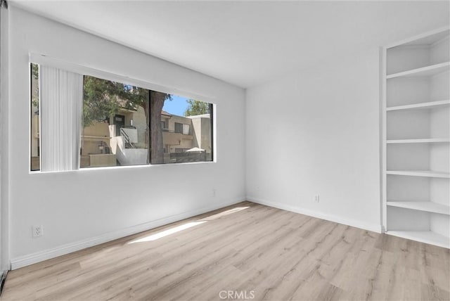 13104 Glen Ct Unit 28, Chino Hills, CA 91709 - empty room with wood finished floors and built in features