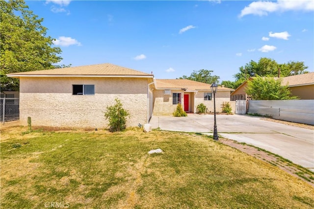 38614 Puerta Ave, Palmdale, CA 93550 - back of house featuring stucco siding and driveway