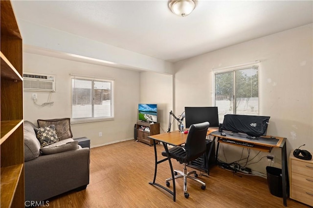 38614 Puerta Ave, Palmdale, CA 93550 - office area with a wall mounted AC, wood finished floors, and plenty of natural light