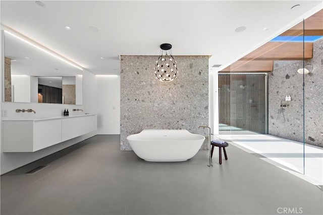 2460 Monaco Dr, Laguna Beach, CA 92651 - full bathroom with a freestanding tub, concrete floors, and double vanity