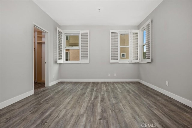 8308 Atlanta Ave Unit 101, Huntington Beach, CA 92646 - unfurnished room with wood finished floors and baseboards