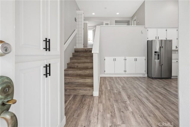 8308 Atlanta Ave Unit 101, Huntington Beach, CA 92646 - staircase with wood finished floors and recessed lighting