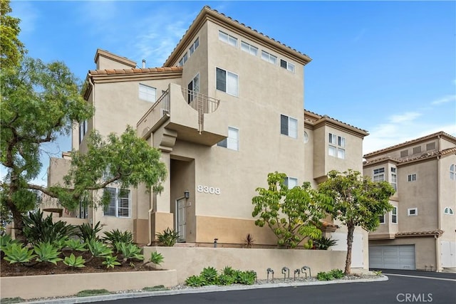 8308 Atlanta Ave Unit 101, Huntington Beach, CA 92646 - view of property with a garage