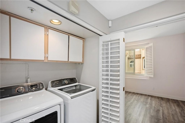 8308 Atlanta Ave Unit 101, Huntington Beach, CA 92646 - laundry room featuring cabinet space, washer and dryer, light wood-type flooring, baseboards, and recessed lighting
