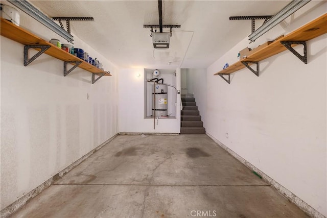 8308 Atlanta Ave Unit 101, Huntington Beach, CA 92646 - garage featuring water heater, a garage door opener, and baseboards