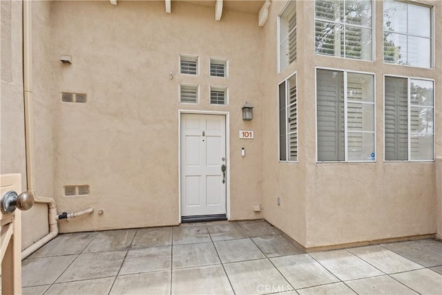8308 Atlanta Ave Unit 101, Huntington Beach, CA 92646 - property entrance with stucco siding and a patio area