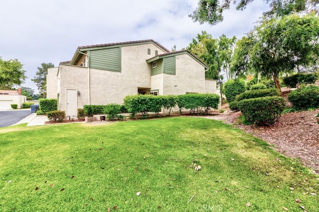 1666 Albany Ct, Claremont, CA 91711 - view of side of property with stucco siding and a yard