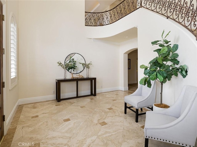 120 Via Alameda, Redondo Beach, CA 90277 - foyer with arched walkways, a high ceiling, baseboards, and crown molding
