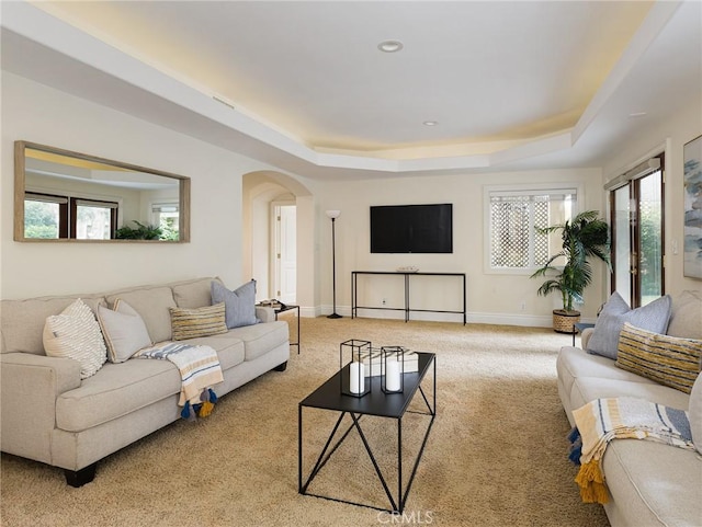 120 Via Alameda, Redondo Beach, CA 90277 - living area featuring arched walkways, a raised ceiling, light carpet, baseboards, and recessed lighting