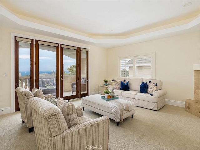 120 Via Alameda, Redondo Beach, CA 90277 - living area featuring light carpet, a tray ceiling, french doors, and baseboards