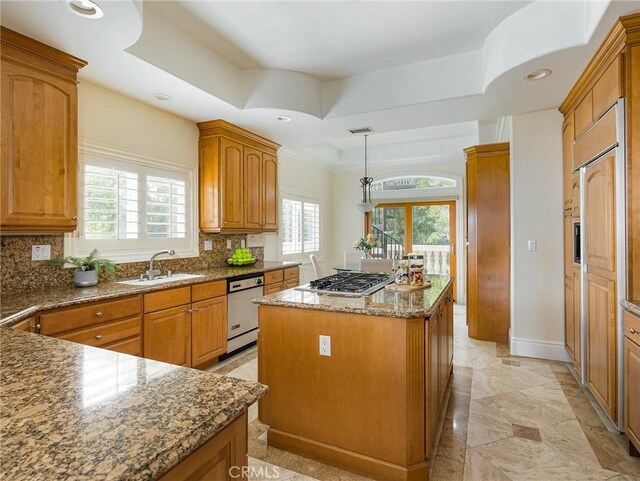 120 Via Alameda, Redondo Beach, CA 90277 - kitchen with dishwasher, a kitchen island, stainless steel gas cooktop, backsplash, and brown cabinets