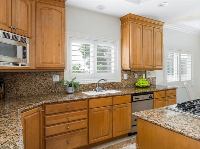 120 Via Alameda, Redondo Beach, CA 90277 - kitchen with stainless steel appliances, stone counters, decorative backsplash, crown molding, and brown cabinetry