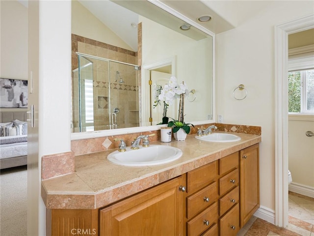 120 Via Alameda, Redondo Beach, CA 90277 - ensuite bathroom featuring double vanity, a shower stall, toilet, and vaulted ceiling