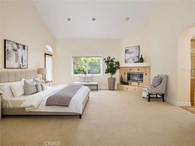 120 Via Alameda, Redondo Beach, CA 90277 - carpeted bedroom featuring arched walkways, high vaulted ceiling, baseboards, and a fireplace