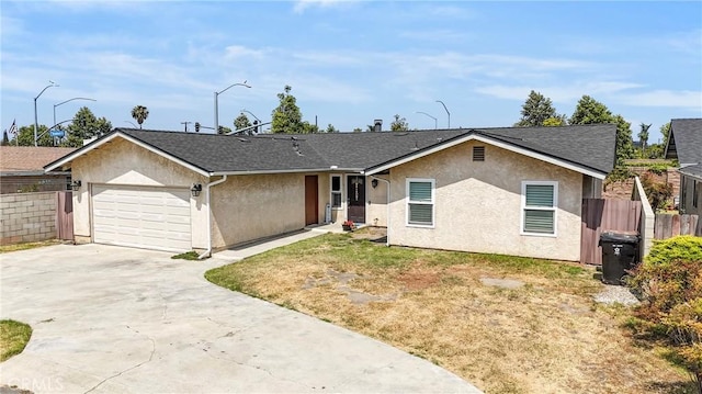 1257 N Brookhurst St, Anaheim, CA 92801 - ranch-style home with stucco siding, an attached garage, driveway, and roof with shingles