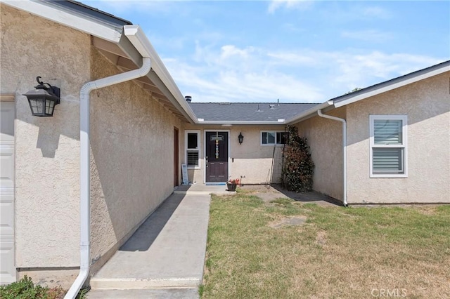 1257 N Brookhurst St, Anaheim, CA 92801 - doorway to property with stucco siding and a yard