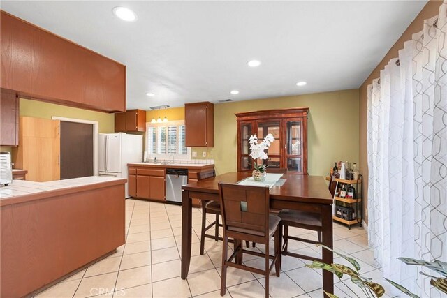 1257 N Brookhurst St, Anaheim, CA 92801 - dining area with light tile patterned floors and recessed lighting