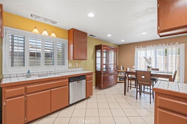 1257 N Brookhurst St, Anaheim, CA 92801 - kitchen with stainless steel dishwasher, tile counters, a sink, and recessed lighting