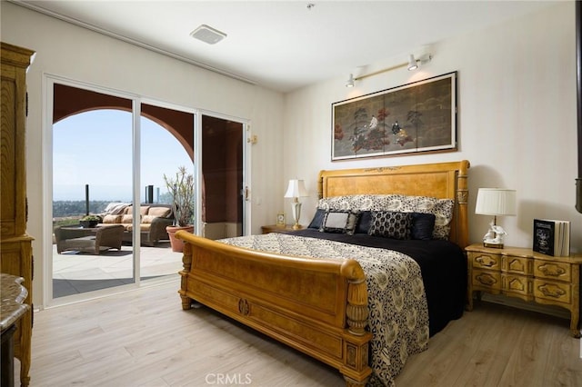 11 Classico Dr, Newport Coast, CA 92657 - bedroom featuring access to exterior and light wood-type flooring