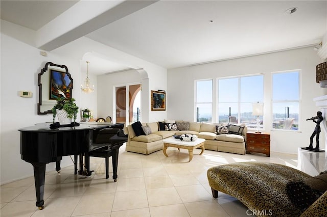 11 Classico Dr, Newport Coast, CA 92657 - living room featuring light tile patterned floors, a chandelier, and arched walkways