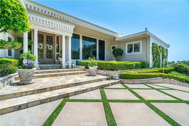 15850 Arbela Dr, Whittier, CA 90603 - back of house featuring french doors and stucco siding