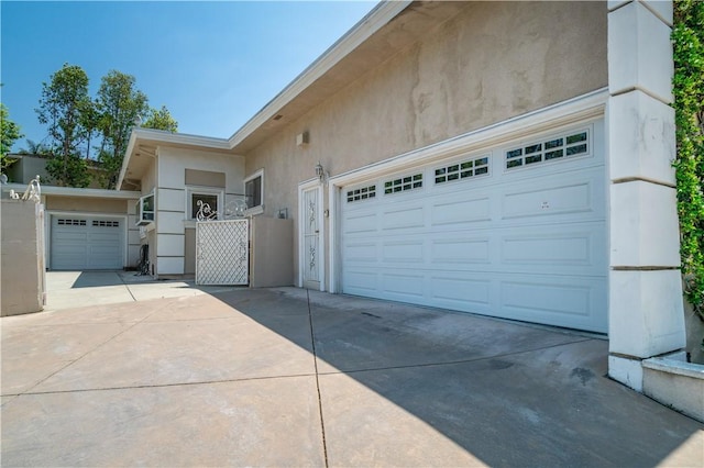 15850 Arbela Dr, Whittier, CA 90603 - garage with concrete driveway and a gate