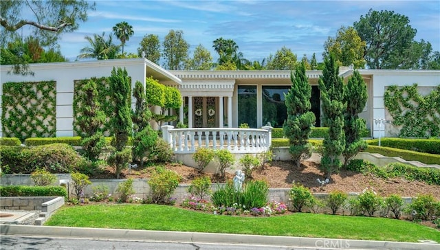15850 Arbela Dr, Whittier, CA 90603 - view of front facade with a front yard, stucco siding, and covered porch